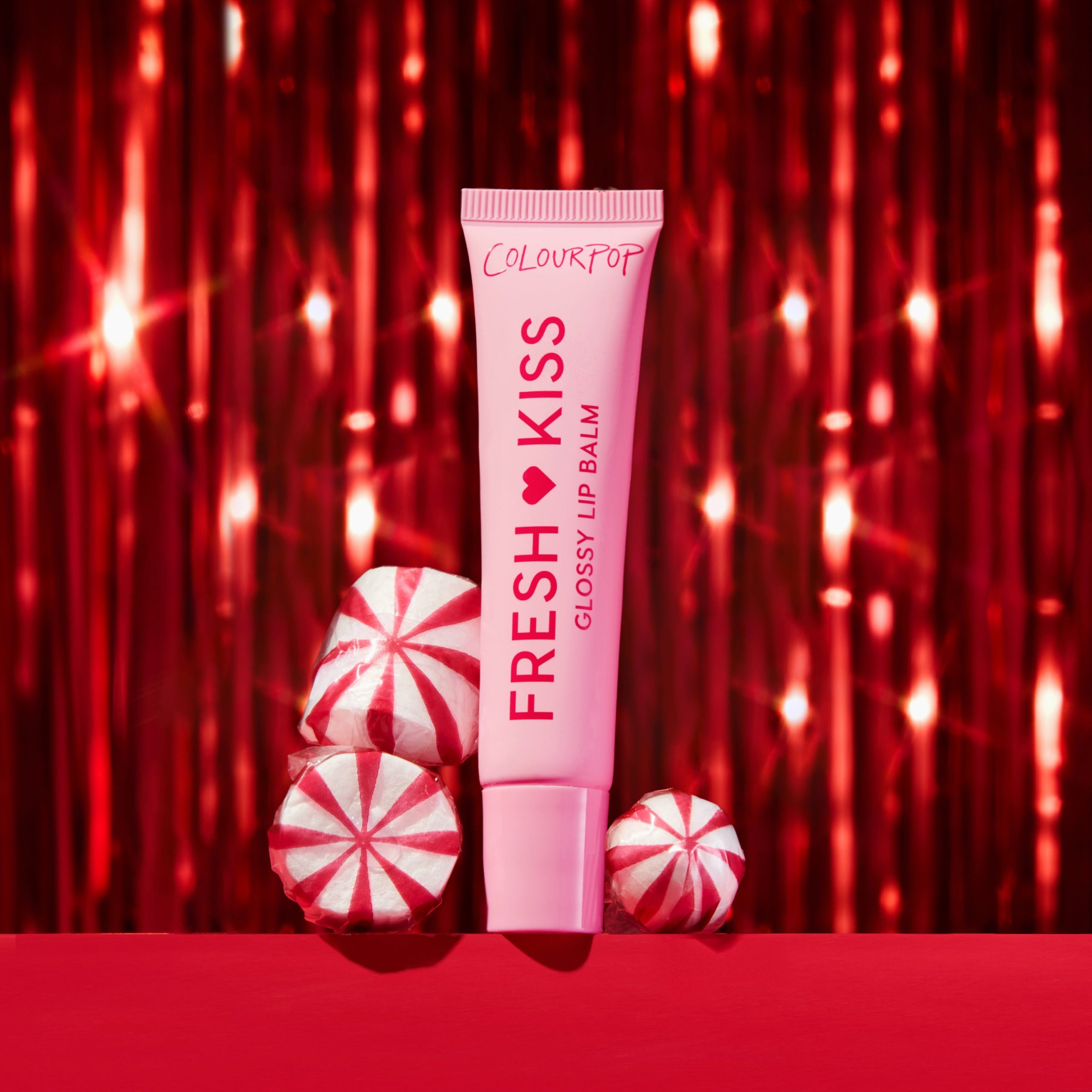 GlossyBalm_Holiday_Stylized21 <strong class=aaaaa>Candy Cane</strong><br/><span class=bbbbb>Fresh Kiss Glossy Balm</span><br/><b class=ccccc>Peptide Glossy Lip Balm</b> - Image 1